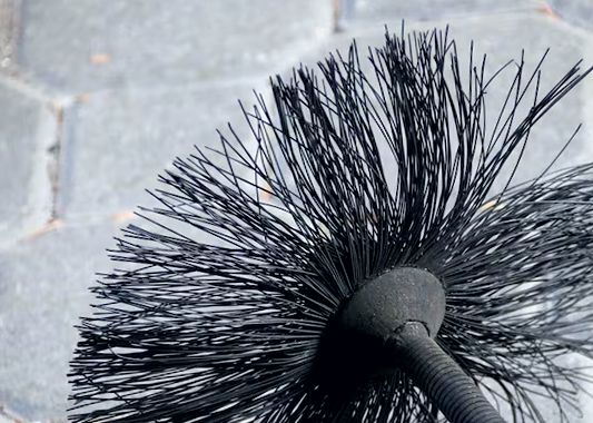 Poly sweeping brush resting on its coiled line