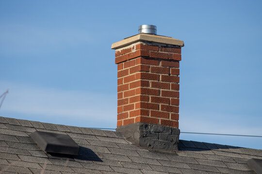 Textured brick chimney fitted with a stainless collar